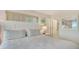 Comfortable main bedroom with neutral tones, shuttered windows, and tasteful decor creating a serene retreat at 6951 Gulf Of Mexico Dr # 14, Longboat Key, FL 34228