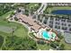 An aerial view of the community clubhouse, golf course and swimming pool at 7019 Grand Estuary Trl # 101, Bradenton, FL 34212