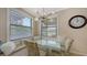 Charming breakfast nook with built-in bench, ample windows, and a stylish light fixture at 7019 Grand Estuary Trl # 101, Bradenton, FL 34212