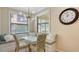 Cozy breakfast nook features built-in bench seating, modern lighting, and view of the outdoors at 7019 Grand Estuary Trl # 101, Bradenton, FL 34212