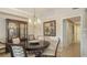 Elegant dining room with stylish decor and a dark wood dining table, creating a sophisticated atmosphere at 7019 Grand Estuary Trl # 101, Bradenton, FL 34212