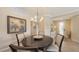 Cozy dining area with a modern chandelier and stylish decor, offering a warm ambiance at 7019 Grand Estuary Trl # 101, Bradenton, FL 34212