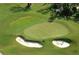 Aerial view of the golf course featuring manicured greens, sand traps, and golfer on the green at 7019 Grand Estuary Trl # 101, Bradenton, FL 34212