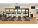 Well-equipped fitness center with treadmills, elliptical, and TVs for an engaging workout experience at 7019 Grand Estuary Trl # 101, Bradenton, FL 34212