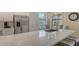 Bright kitchen with stainless steel appliances, breakfast nook, and quartz countertops at 7019 Grand Estuary Trl # 101, Bradenton, FL 34212