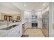 Modern kitchen with stainless steel appliances, white cabinets, and open concept living at 7019 Grand Estuary Trl # 101, Bradenton, FL 34212