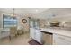 Open-concept kitchen with a breakfast nook, stainless steel appliances, and scenic views of the golf course at 7019 Grand Estuary Trl # 101, Bradenton, FL 34212