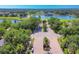 Aerial view of Serenoa community entrance surrounded by lush greenery and scenic landscapes at 7441 Myrica Dr, Sarasota, FL 34241