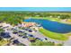 Scenic aerial view of golf course and clubhouse situated on a lake at 7441 Myrica Dr, Sarasota, FL 34241