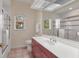 Bathroom with a large mirror and a sink at 7441 Myrica Dr, Sarasota, FL 34241