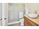 Bathroom featuring glass-enclosed shower, granite countertop, and modern fixtures at 7441 Myrica Dr, Sarasota, FL 34241
