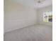 Bedroom featuring carpet, a large window and neutral-colored walls at 7441 Myrica Dr, Sarasota, FL 34241