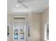 Bright bedroom with carpet, neutral walls, ceiling fan and large door leading to the pool area at 7441 Myrica Dr, Sarasota, FL 34241