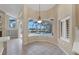 Bright breakfast nook with views of the screened in lanai and pool at 7441 Myrica Dr, Sarasota, FL 34241