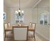 Dining room featuring dining table, chairs, and large mirrors at 7441 Myrica Dr, Sarasota, FL 34241