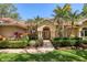 Stunning one-story home featuring a tile roof and manicured landscaping with double-door entrance at 7441 Myrica Dr, Sarasota, FL 34241