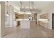 Spacious kitchen featuring light wood cabinets, island, and recessed lighting at 7441 Myrica Dr, Sarasota, FL 34241