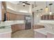 Open kitchen with updated stainless appliances and light-colored cabinets at 7441 Myrica Dr, Sarasota, FL 34241