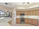 Bright kitchen featuring wood cabinets, stainless steel appliances, and tile backsplash at 7441 Myrica Dr, Sarasota, FL 34241