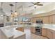 Open kitchen with an island, stainless appliances, and a beautiful pool view at 7441 Myrica Dr, Sarasota, FL 34241