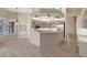 Open kitchen with stainless appliances, tile floors, and a large island perfect for entertaining at 7441 Myrica Dr, Sarasota, FL 34241
