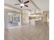 Bright living room and kitchen boasts an open floor plan with modern appliances and tile flooring at 7441 Myrica Dr, Sarasota, FL 34241