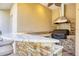 Outdoor kitchen features a stone backsplash, granite countertops, and a built in grill at 7441 Myrica Dr, Sarasota, FL 34241