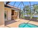 Outdoor pool and patio area with an outdoor bar and grill at 7441 Myrica Dr, Sarasota, FL 34241