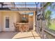 A fully equipped outdoor kitchen and bar are adjacent to a pool at 7441 Myrica Dr, Sarasota, FL 34241