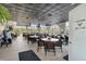 Comfortable dining area with ample seating, multiple TV screens, and lots of natural light at 7441 Myrica Dr, Sarasota, FL 34241