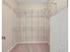 Walk-in closet with multiple shelving and metal bar for hanging clothes at 7441 Myrica Dr, Sarasota, FL 34241
