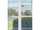 Window view of green trees and lake outside at 7441 Myrica Dr, Sarasota, FL 34241