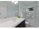 Modern bathroom features a stylish vanity, updated fixtures, and a glass-enclosed shower, for a luxurious spa-like experience at 7532 Greystone St, Lakewood Ranch, FL 34202