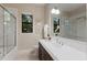 Elegant bathroom featuring a double vanity, large mirror, and a glass-enclosed shower at 7532 Greystone St, Lakewood Ranch, FL 34202