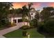 Lovely home featuring lush landscaping, a spacious driveway, and a desirable three-car garage at 7532 Greystone St, Lakewood Ranch, FL 34202