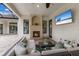 Charming outdoor patio with stone fireplace and comfortable seating at 7532 Greystone St, Lakewood Ranch, FL 34202