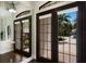 Inviting foyer with French doors and beautiful flooring at 7532 Greystone St, Lakewood Ranch, FL 34202