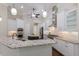 Kitchen with white cabinets, stainless appliances, and a central island at 7532 Greystone St, Lakewood Ranch, FL 34202