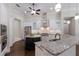 Kitchen with white cabinets, stainless appliances, and a central island at 7532 Greystone St, Lakewood Ranch, FL 34202
