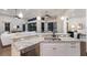 Kitchen island featuring granite counters, stainless steel appliances, and a sink for seamless food preparation at 7532 Greystone St, Lakewood Ranch, FL 34202