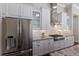 Bright kitchen with stainless steel appliances, custom cabinetry, and granite countertops perfect for culinary creations at 7532 Greystone St, Lakewood Ranch, FL 34202