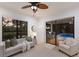 Comfortable living room with a sliding glass doors with outdoor kitchen and pool views at 7532 Greystone St, Lakewood Ranch, FL 34202