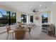 Spacious living area with a round dining table, lots of natural light, and furniture seating at 7532 Greystone St, Lakewood Ranch, FL 34202