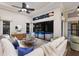 Bright living room with a view of the pool area through large windows at 7532 Greystone St, Lakewood Ranch, FL 34202