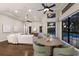Bright living room featuring a modern ceiling fan, and a view of the pool at 7532 Greystone St, Lakewood Ranch, FL 34202