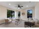 An inviting living area, offering scenic views through large windows and a peaceful atmosphere, ideal for relaxation at 7532 Greystone St, Lakewood Ranch, FL 34202