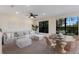 Open-concept living area with natural light, ceiling fan, and dining area, ideal for gatherings and everyday living at 7532 Greystone St, Lakewood Ranch, FL 34202