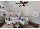 Bright living room with a sitting area, and views of the kitchen at 7532 Greystone St, Lakewood Ranch, FL 34202