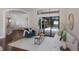 Stylish living room with hardwood floors, comfortable seating, and a large sliding door leading to outdoor pool area at 7532 Greystone St, Lakewood Ranch, FL 34202