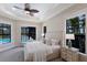 Elegant primary bedroom with serene pool views, creating a tranquil retreat for relaxation and rest at 7532 Greystone St, Lakewood Ranch, FL 34202